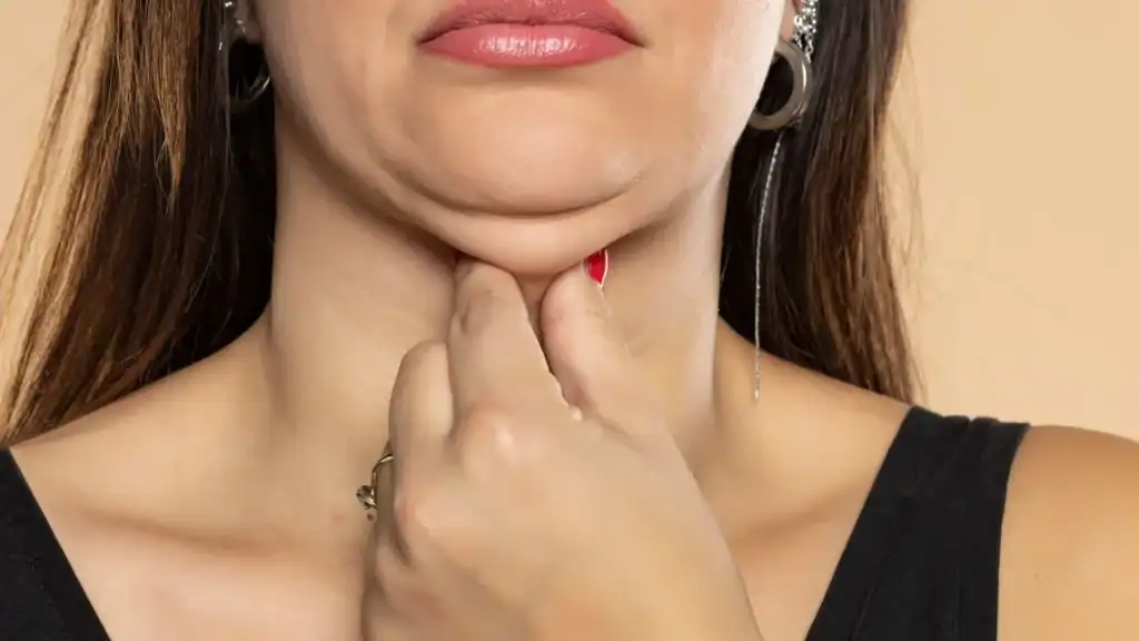 An image of a woman with double chin, sad, worried : Non Surgical Double Chin Removal Treatment in Hackney, UK